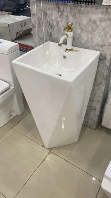 Faceted White Pedestal Basin with Gold Tap